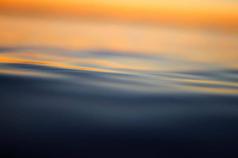 Calm, water, light, darkness by Jeremy Bishop (unsplash.com)